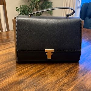 Tory Burch Juliette handbag in brown suede and black leather with gold hardware.